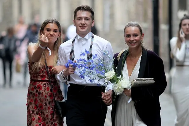 Cambridge University students enjoy themselves as they leave the 2018 May Ball in Cambridge, United Kingdom on June 19, 2018. Some of the students  jumped in the River Cam to cool off. (Photo by Headlinephoto/Splash News and Pictures)
