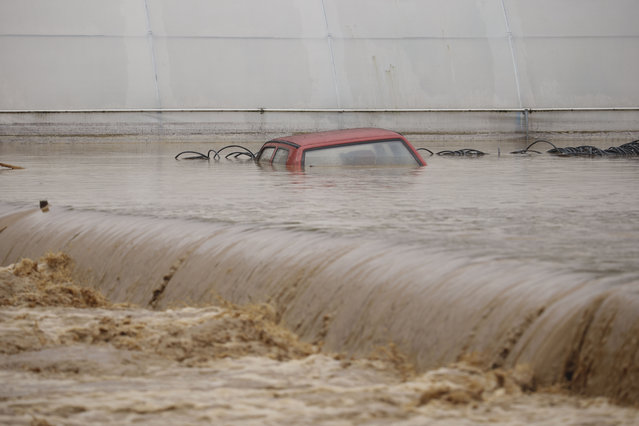 A car is submerged in flood waters outside an apartment building in the village of Kiseljak, northern Bosnia, Friday, October 4, 2024. (Photo: Armin Durgut/AP Photo)