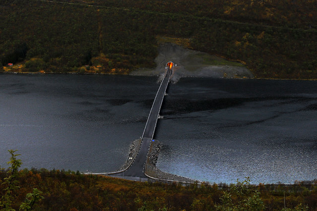 A bridge connects parts of Senja island over a fiord, north of the Arctic Circle in Norway September 29, 2014. (Photo by Yannis Behrakis/Reuters)