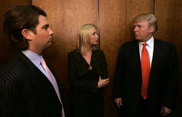 Donald Trump, right, talks with his children Donald Jr., left, and Ivanka in an elevator while visiting his Chicago offices and his 92-story residential tower underconstruction on the Chicago River Wednesday, May 10, 2006. (Photo by Charles Rex Arbogast/AP Photo)