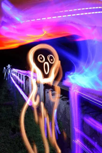 Edvard Munch's The Scream recreated by Michael Bosanko, on July 18, 2013. The light artist has been producing breathtaking light artworks since 2004. (Photo by Caters News)