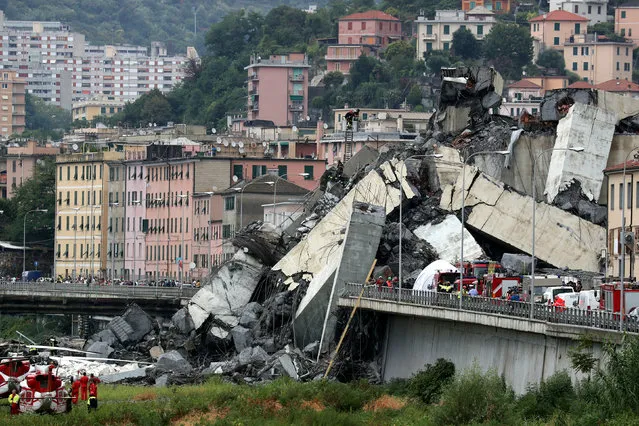 The collapsed Morandi Bridge is seen in the Italian port city of Genoa, Italy August 14, 2018. (Photo by Stefano Rellandini/Reuters)