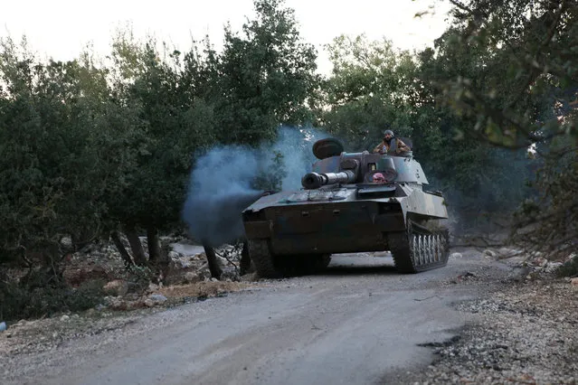 A rebel tank drives in Jubata al-Khashab, Quneitra province, Syria November 26, 2016. (Photo by Alaa Al-Faqir/Reuters)