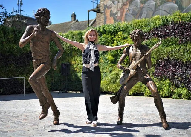 “The Glimmer Twins”, a statue of Rolling Stones Sir Mick Jagger and Keith Richards created by sculptor Amy Goodman (centre), is unveiled at One Bell Corner in Dartford, Essex, UK on Wednesday, August 9, 2023. The statue has been commissioned by Dartford Borough Council to celebrate two of the town's most famous former residents. (Photo by Yui Mok/PA Images via Getty Images)