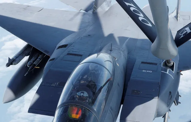 A F15 is refuelled by a U.S Air Force KC-135 during a European Tanker Symposium from RAF Mildenhall,  Britain May 17, 2018. (Photo by Darren Staples/Reuters)