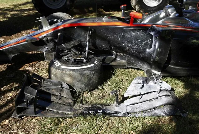 The damaged car of McLaren Formula One driver Kevin Magnussen of Denmark is seen after he crashed during the second practice session of the Australian F1 Grand Prix at the Albert Park circuit in Melbourne March 13, 2015.   REUTERS/Jason Reed