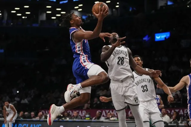 Philadelphia 76ers' Tyrese Maxey, left, drives past Brooklyn Nets' Dorian Finney-Smith, center, and Nic Claxton during the first half of a preseason NBA basketball game, Monday, October 16, 2023, in New York. (Photo by Frank Franklin II/AP Photo)