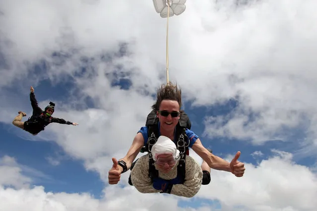 This handout taken on December 9, 2018 and released by SA Skydiving shows 102-year-old great-grandmother Irene OShea during her skydive tandem jump over Wellington in South Australia. A 102-year-old great-grandmother is believed to have become the world's oldest skydiver after plunging 14,000 feet (4,300 metres) through the South Australian sky. She completed her first skydive to mark her 100th birthday in 2016, but organisers claimed it was the successful tandem dive on December 9 at the age of 102 years and 194 days that earned her a place in the history books. (Photo by Bryce Sellick and Matt Teager/AFP Photo/SA Skydiving)