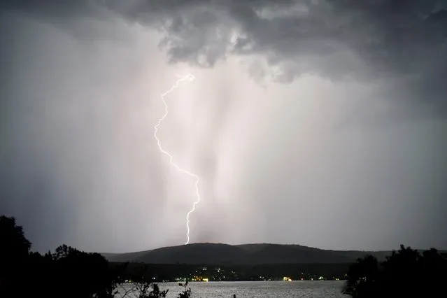 A lightning storm is seen over the Tequesquitengo lake, in Tequesquitengo, Mexico on July 1, 2023. (Photo by Andres Stapff/Reuters)