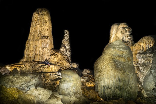 A cave explorer amongst giant stalagmites in the Stairway to Heaven area of the cave on March 2015 at Tham Khoun Ex, Laos. (Photo by John Spies/Barcroft Media/ABACAPress)
