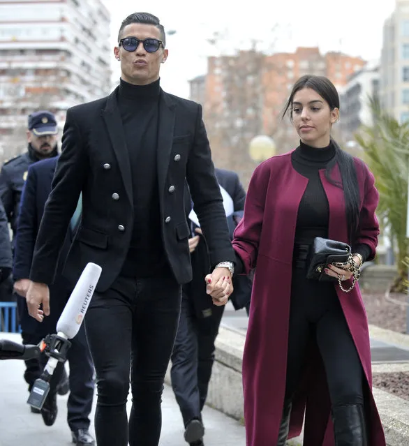 Cristiano Ronaldo and Georgina Rodriguez arrive at the Audiencia Provincial on January 22, 2019 in Madrid, Spain. Cristiano has been called to declare for tax fraud case. (Photo by Europa Press Entertainment/Europa Press via Getty Images)