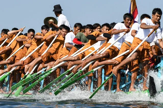 Men practice leg-rowing boat race during the Phaung Daw Oo pagoda festival on Inle Lake, Southern Shan State on October 19, 2023. (Photo by Sai Aung Main/AFP Photo)
