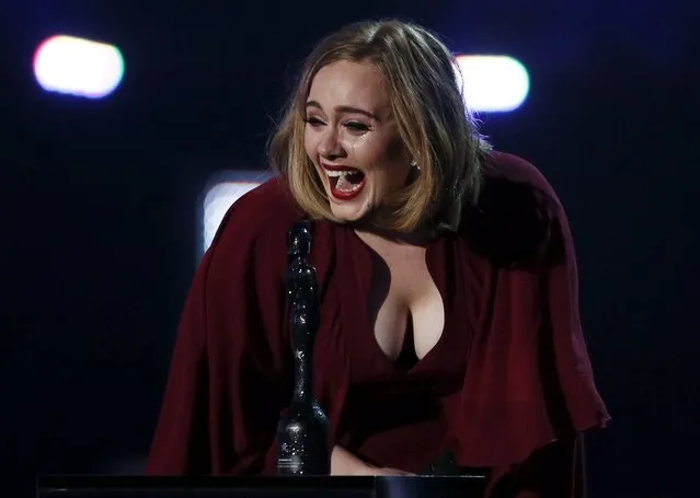 Adele reacts as she accepts the global success award at the BRIT Awards at the O2 arena in London, February 24, 2016. (Photo by Stefan Wermuth/Reuters)
