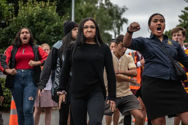 Youngsters perform a Haka during a students vigil near Al Noor mosque on March 18, 2019 in Christchurch, New Zealand. 50 people were killed, and dozens are still injured in hospital after a gunman opened fire on two Christchurch mosques on Friday, 15 March. The accused attacker, 28-year-old Australian, Brenton Tarrant, has been charged with murder and remanded in custody until April 5. The attack is the worst mass shooting in New Zealand's history. (Photo by Carl Court/Getty Images)