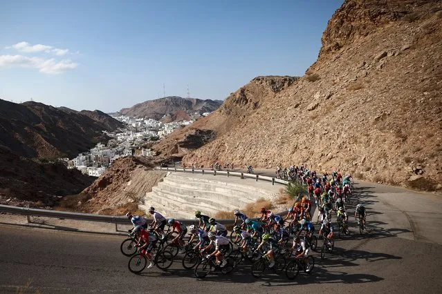 The pack ride during the Muscat Classic race between Al Mouj Muscat and Al Bustan on the eve of the first stage of Tour of Oman on February 9, 2024 in Muscat. (Photo by Anne-Christine Poujoulat/AFP Photo)
