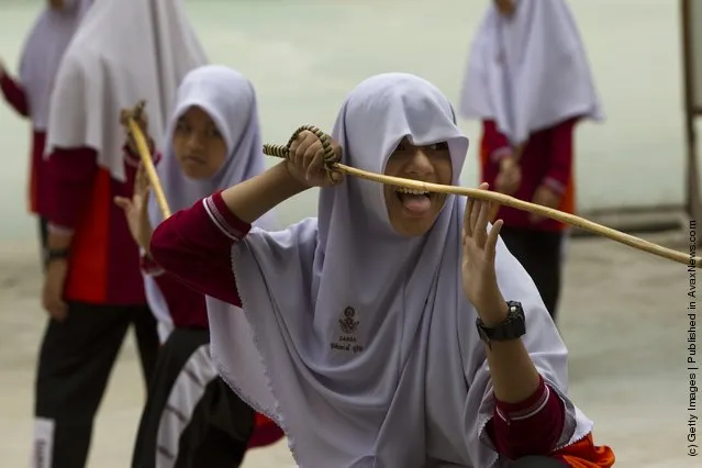 Islamic female students practice the ancient Thai art of Krabi Krabong taught as a sport at the Darunsat Wittaya school