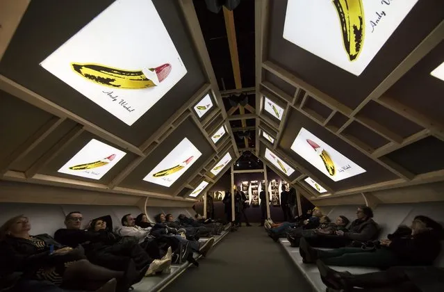 Visitors lay down to watch a documentary displayed as part of the retrospective exhibition “The Velvet Underground – New York Extravaganza” held at the Philharmonie de Paris, in Paris, France, 29 March 2016. The exhibition runs from 30 March to 21 August. The Velvet Underground was an New York rock band (1964- 1973). (Photo by Ian Langsdon/EPA)