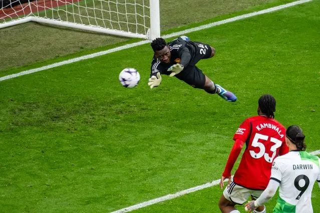 Andre Onana of Manchester United makes a save during the Premier League match between Manchester United and Liverpool FC at Old Trafford on April 07, 2024 in Manchester, England. (Photo by Ash Donelon/Manchester United via Getty Images)