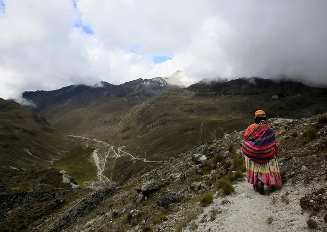 An Aymara indigenous woman walks on the Huayna Potosi mountain, Bolivia April 6, 2016. (Photo by David Mercado/Reuters)