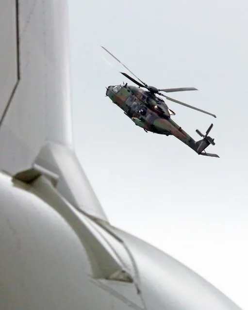 A French army NH 90 Caiman helicopter performs its demonstration flight at the Paris Air Show in Le Bourget, north of Paris, Thursday June 18, 2015. Some 300,000 aviation professionals and spectators are expected at this week's Paris Air Show, coming from around the world to make business deals and see dramatic displays of aeronautic prowess and the latest air and space technology. (AP Photo/Remy de la Mauviniere)