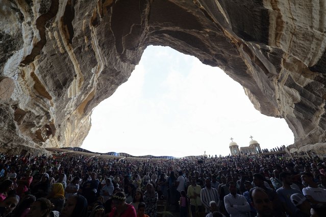 Coptic Orthodox Christians gather as they attend a Palm Sunday mass at the Samaan el-Kharaz Monastery in the Mokattam Mountain area of Cairo, Egypt, on April 28, 2024. (Photo by Amr Abdallah Dalsh/Reuters)