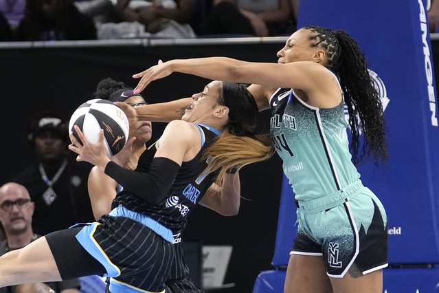 Chicago Sky's Chennedy Carter, left, steals the ball from New York Liberty's Betnijah Laney-Hamilton during the first half of a WNBA basketball game Tuesday, June 4, 2024, in Chicago. (Photo by Charles Rex Arbogast/AP Photo)
