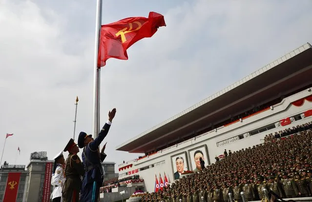 North Korean soldiers hoist the Communist Party flag during a parade for the “Day of the Sun” festival on Kim Il Sung Square in Pyongyang, North Korea, 15 April 2017. (Photo by How Hwee Young/EPA)