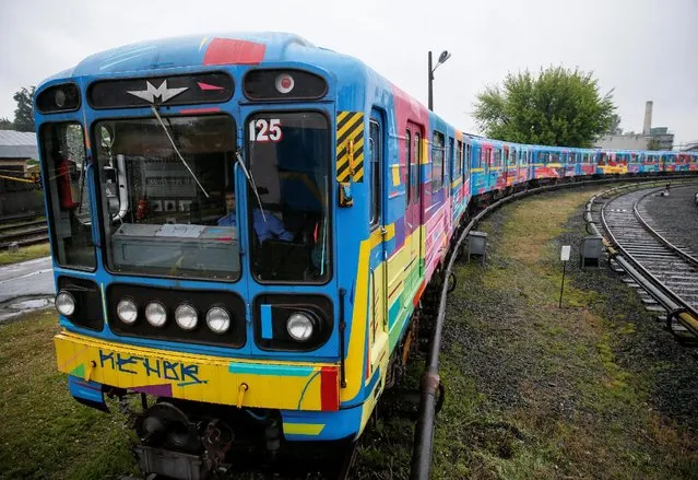 A Kiev metro train painted by Spanish artist Kenor as a gift to the Ukrainian capital is seen in a depot in Kiev, Ukraine, May 17, 2016. (Photo by Gleb Garanich/Reuters)