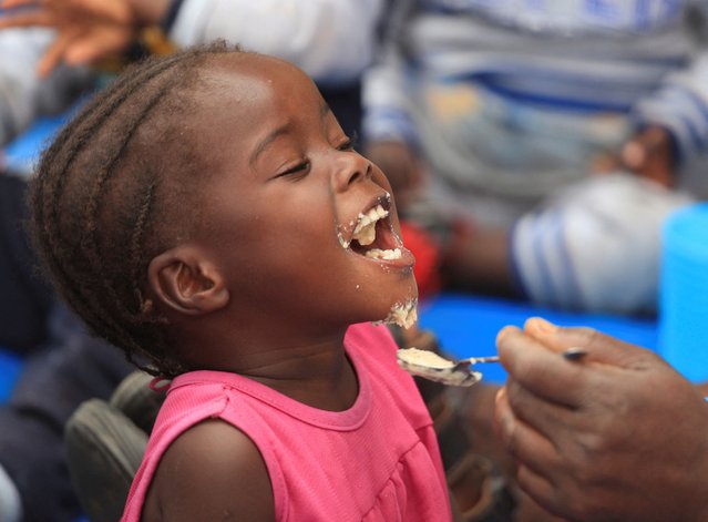 A child eats traditional porridge at a rural home, as Zimbabwe is experiencing an El Nino-induced drought, resulting in malnutrition among children under the age of five, pregnant and lactating women, and adolescents, in Kotwa in Mudzi district, Zimbabwe on July 2, 2024. (Photo by Philimon Bulawayo/Reuters)