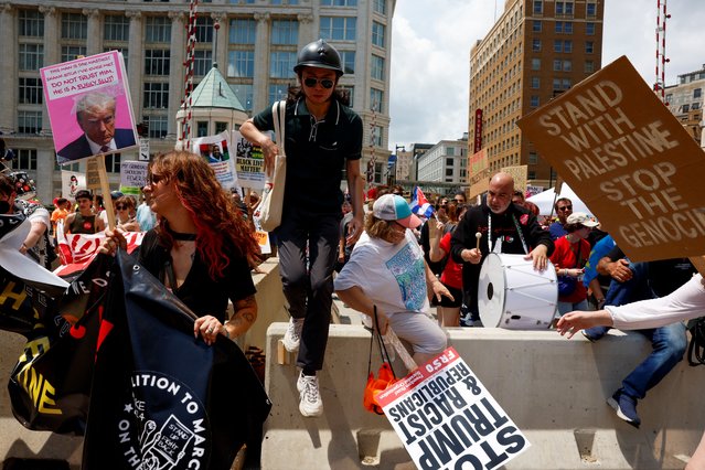 Demonstrators and members of the The Coalition to March on the RNC hold a rally, on the first day of the Republican National Convention (RNC) in Milwaukee, Wisconsin, U.S. July 15, 2024. (Photo by Evelyn Hockstein/Reuters)