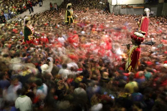 Revellers dace as they take part in the Patum in the Catalan village of Berga, Spain Friday, May 27, 2016. (Photo by Emilio Morenatti/AP Photo)