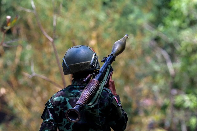 A soldier from the Karen National Liberation Army (KNLA) carries an RPG launcher at a Myanmar military base at Thingyan Nyi Naung village on the outskirts of Myawaddy, the Thailand-Myanmar border town under the control of a coalition of rebel forces led by the Karen National Union, in Myanmar, on April 15, 2024. (Photo by Athit Perawongmetha/Reuters)