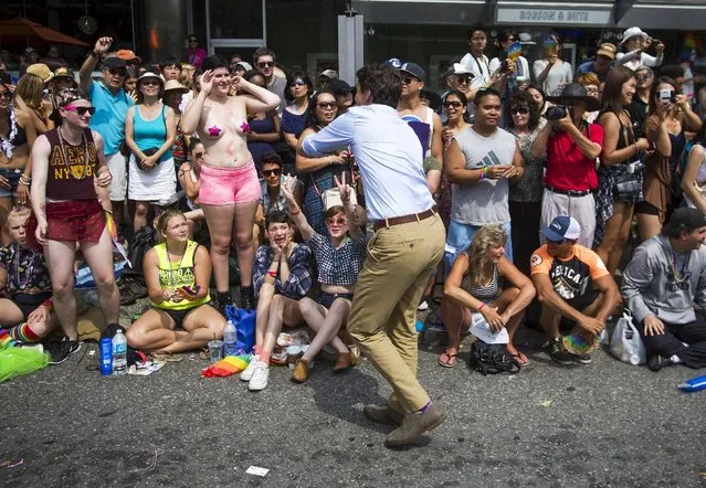 Justin Trudeau, leader of the Liberal Party of Canada, interacts with people during the 37th Annual Vancouver Pride Parade in Vancouver, British Columbia August 2, 2015. (Photo by Ben Nelms/Reuters)