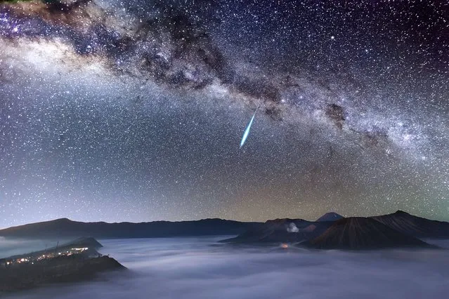 Eta Aquarid Meteor Shower over Mount Bromo by Justin Ng (Singapore). A bright meteor streaks across the magnificent night sky over the smoke-spewing Mount Bromo just one day before the peak of the Eta Aquarid meteor shower, which is caused by Halley’s Comet. Mount Bromo is one of the most well-known active volcanoes in East Java, Indonesia. Also seen in the photograph are the highest active volcano, Mount Semeru (3676m), and the extinct volcano, Mount Batok, which is located to the right of Mount Bromo. (Photo by Justin Ng)