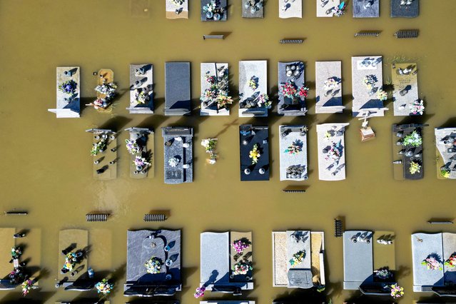 Drone view of graves submerged by floodwater at a cemetery in Brzeszcze, Poland on September 15, 2024. (Photo by Jakub Wlodek/Agencja Wyborcza via Reuters)