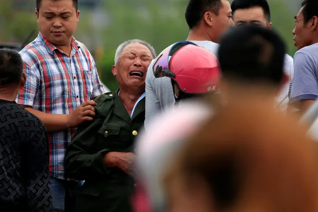 A family member of a victim cries after a tornado hit Funing on Thursday, in Yancheng, Jiangsu province, June 24, 2016. (Photo by Aly Song/Reuters)