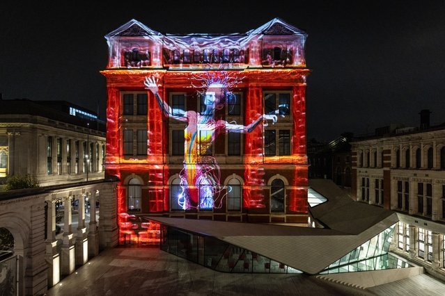 A preview of a specially commissioned AI artwork from Ouchhh Studio, made using cognitive technology to visualise brainwaves of the Arts & Film “Game Changers” is projected across the facade of the V&A's Exhibition Road Courtyard building in London on Thursday, October 31, 2024, ahead of it being publicly unveiled tomorrow night as part of The National Lottery's 30th birthday celebrations. (Photo by James Speakman/PA Media Assignments)