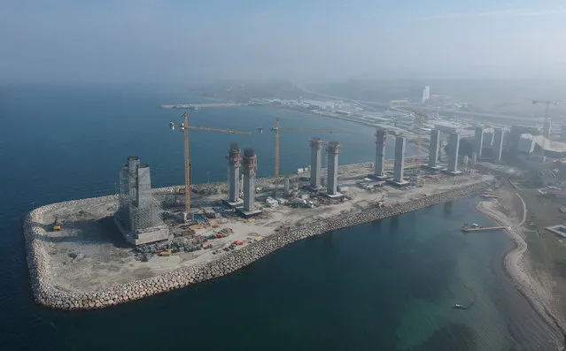 Constructions of Canakkale 1915 Bridge's red and white towers are underway on February 19, 2020 in Canakkale, Turkey. 56,3 percent of bridge towers are completed. Some symbolic figures are associated with the bridge. The name “1915” and the groundbreaking date “March 18” are related to the Turkish Naval Victory on March 18, 1915 during the naval operations in the Gallipoli Campaign. It is expected to become the longest suspension bridge in the world, once completed. Red and white symbolize the colors of the Turkish flag. (Photo by Burak Akay/Anadolu Agency via Getty Images)