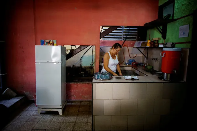 Aridania Rubens works beside a Chinese-made Haier refrigerator at her restaurant in Havana, Cuba, February 10, 2017. (Photo by Alexandre Meneghini/Reuters)