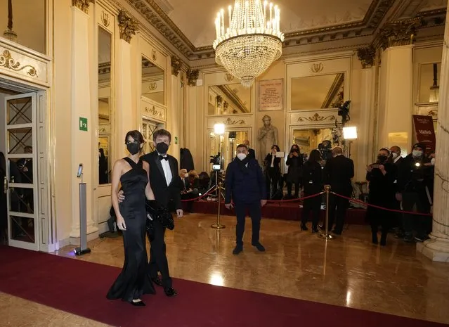 Italian Culture Minister Dario Franceschini arrives with his wife Michela Di Biase for the premiere of Verdi's Macbeth at La Scala opera house in Milan, Italy, Tuesday, December 7, 2021. The Macbeth opens the 2021/2021 lyric season of one of the most storied opera house in the world. (Photo by Antonio Calanni/AP Photo)