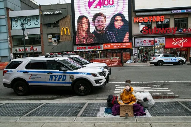 A homeless person wears a face mask during the outbreak of coronavirus disease (COVID-19), in New York City, New York, U.S., March 17, 2020. (Photo by Eduardo Munoz/Reuters)