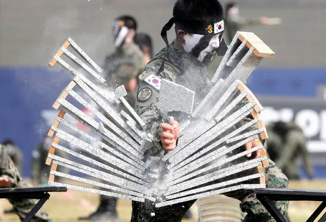 Members of the Special Warfare Command give a demonstration of their skills in the traditional Korean martial art of taekwondo during a photo opportunity ahead of a celebration to mark the 69th anniversary of Korea Armed Forces Day, in Pyeongtaek, South Korea, September 25, 2017. (Photo by Kim Hong-Ji/Reuters)