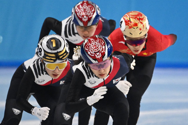 South Korea's Choi Min-jeong (C) and South Korea's Kim Gil-li (L) compete in the women's 1000m final short track speed skating event during the Harbin 2025 Asian Winter Games in Harbin, northeast China's Heilongjiang province on February 9, 2025. (Photo by Jade Gao/AFP Photo)