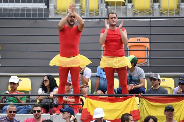Spanish fans attend the men's singles third round tennis match between Spain's Rafael Nadal and France's Gilles Simon at the Olympic Tennis Centre of the Rio 2016 Olympic Games in Rio de Janeiro on August 11, 2016. Nadal won the match 7-6 (5), 6-3. (Photo by Martin Bernetti/AFP Photo)