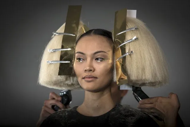 A model has her hair done before The Blonds Spring/Summer 2016 collection during New York Fashion Week in New York September 16, 2015. (Photo by Carlo Allegri/Reuters)
