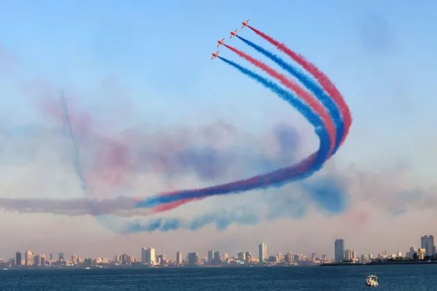 The British Royal Air Force's (RAF) aerobatic team, the “Red Arrows”, performs aerial manoeuvres during an airshow in Kuwait City on November 21, 2022. (Photo by Yasser Al-Zayyat/AFP Photo)