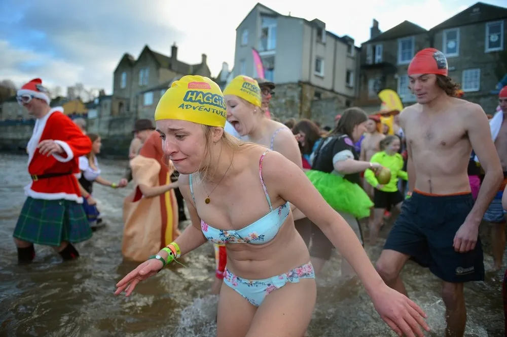 Swimmers Brave the Loony Dook New Years Day Swim by Forth Bridge