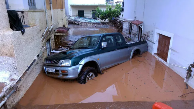 An abandoned vehicle is seen on a flooded street in Kalamata, Greece September 7, 2016. (Photo by Dimitris Plemmenos/Reuters/Eurokinissi)