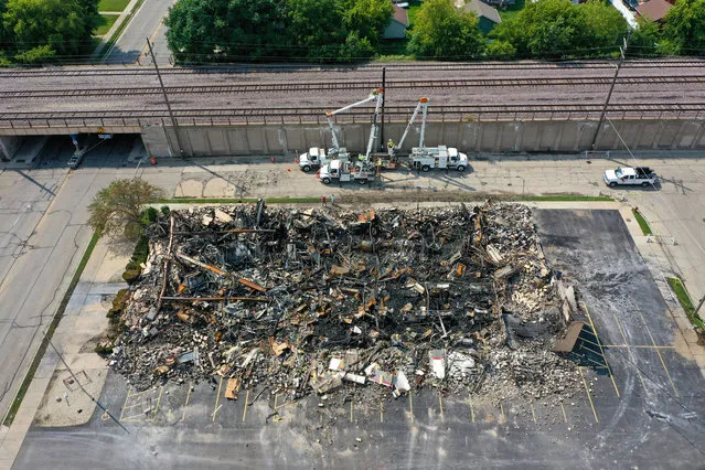A view of a damaged area after a group of protestors who lit dealership last night over the shooting of a black man Jacob Blake by police officer in Kenosha, Wisconsin, United States on August 25, 2020. The Wisconsin National Guard has been deployed to Kenosha after the man was shot several times at close range in the back during an encounter with a police officer, which was caught on video. (Photo by Tayfun Coskun/Anadolu Agency via Getty Images)