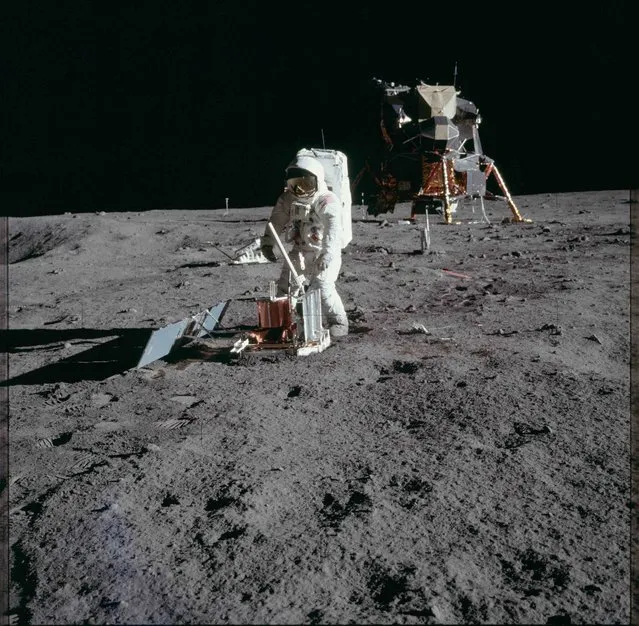 Astronaut Edwin E. Aldrin Jr., lunar module pilot, deploys a scientific research package on the surface of the moon near the Lunar Module (LM) "Eagle" during the Apollo 11 extravehicular activity (EVA) in this July 20, 1969 NASA handout photo. (Photo by Reuters/NASA)